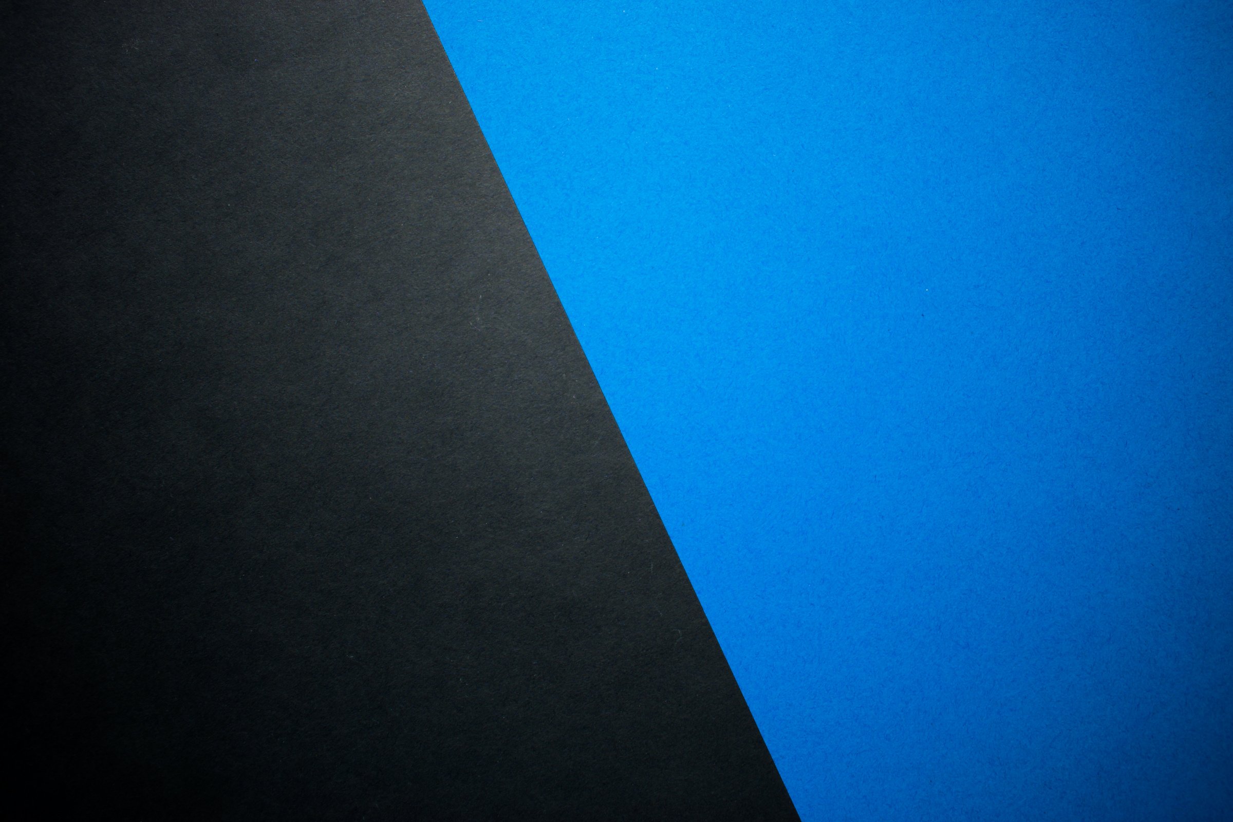 Diagonally divided blue and black background, website template, colored paper